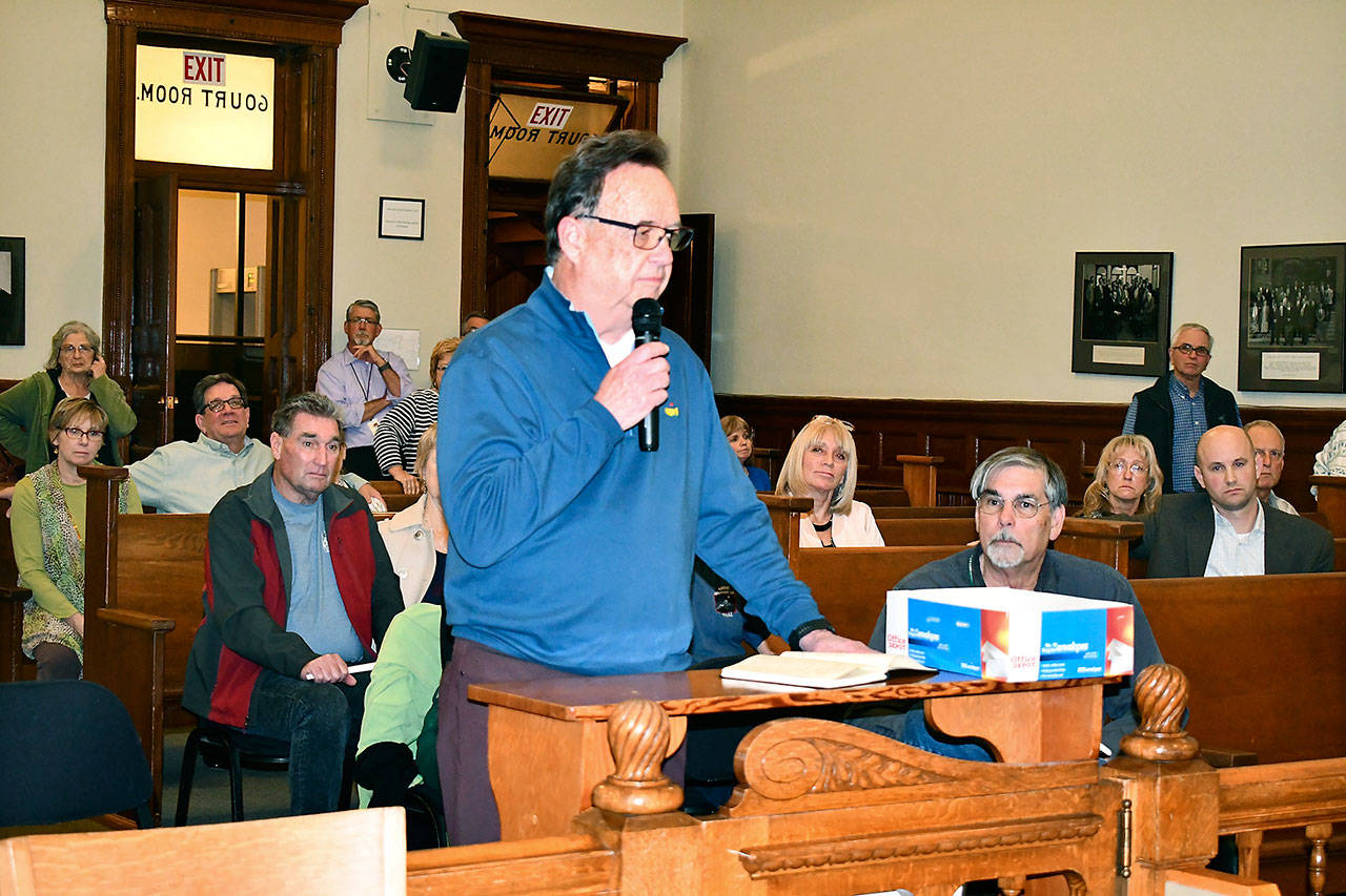 Statesman Group CEO Garth Mann addresses the county commissioners Monday night on his company’s plans to develop the Pleasant Harbor Master Planned Resort in Brinnon. Mann said he was committed to doing a good job and to make the area “better for your children and grandchildren.” (Jeannie McMacken/Peninsula Daily News)
