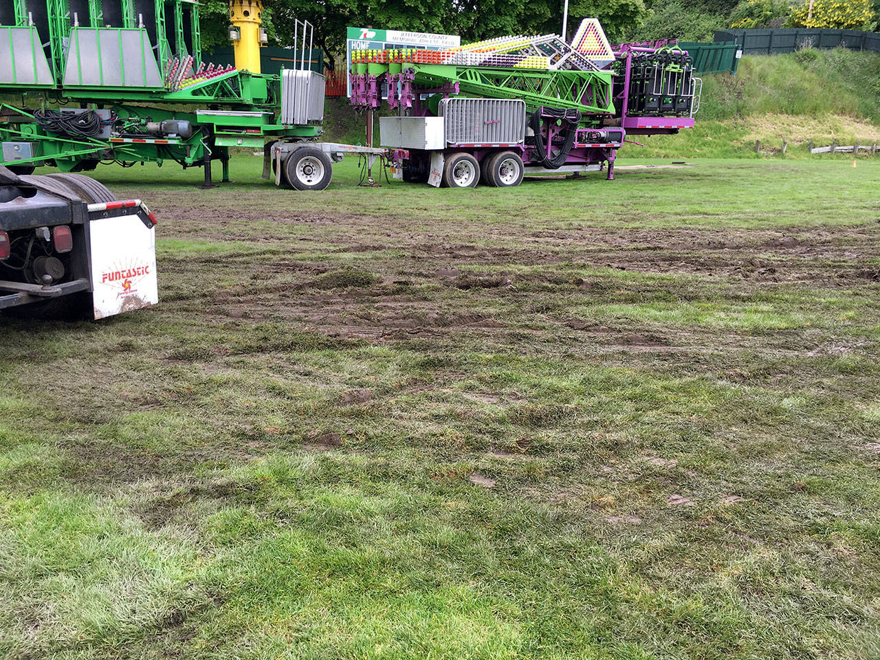 Jefferson County commissioners were disappointed in the heavy field damage caused by Rhody Fests Funtastic fund-raising carnival last May. It took two months to repair ruts, turf and damage to the irrigation system. Although the carnival paid $5,000 in damage deposits, county officials said it didnt cover the true cost of the repairs and the displacement of other programs that were scheduled to use the field. (Jefferson County).