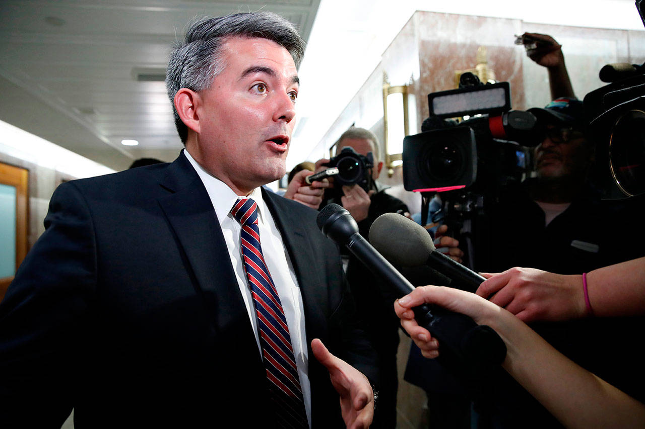 In this Jan. 22, file photo Sen. Cory Gardner, R-Colo., left, speaks to the media after attending a meeting with a bipartisan group of senators on day three of the government shutdown on Capitol Hill in Washington, D.C. (Jacquelyn Martin/The Associated Press)
