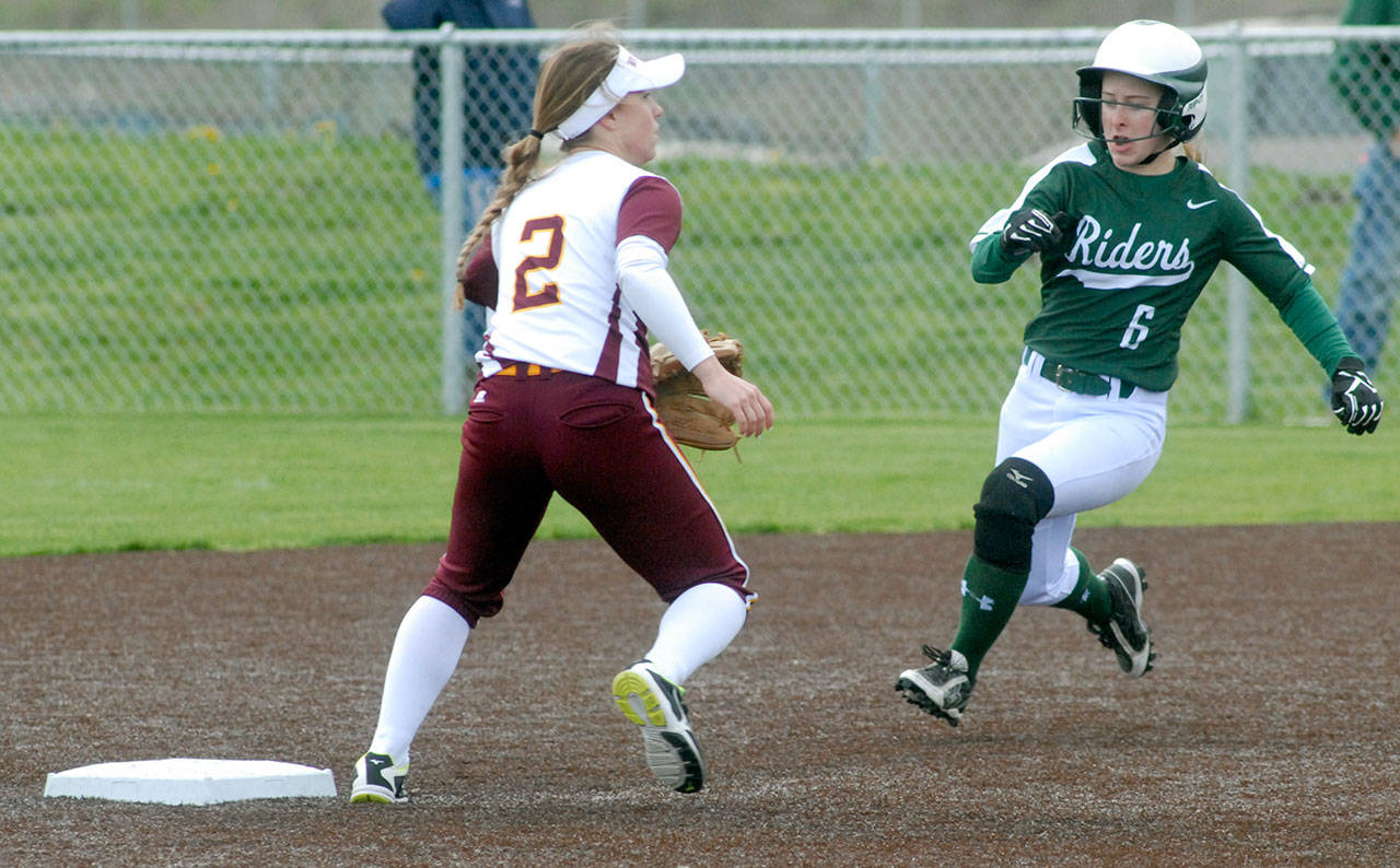 Keith Thorpe/Peninsula Daily News Port Angeles’ Sierra Robinson, right, races to steal second as White River shortstop Megan Vandegrift waits for the ball during the fifth inning on Saturday at Billy Whiteshoes Memorial Park.