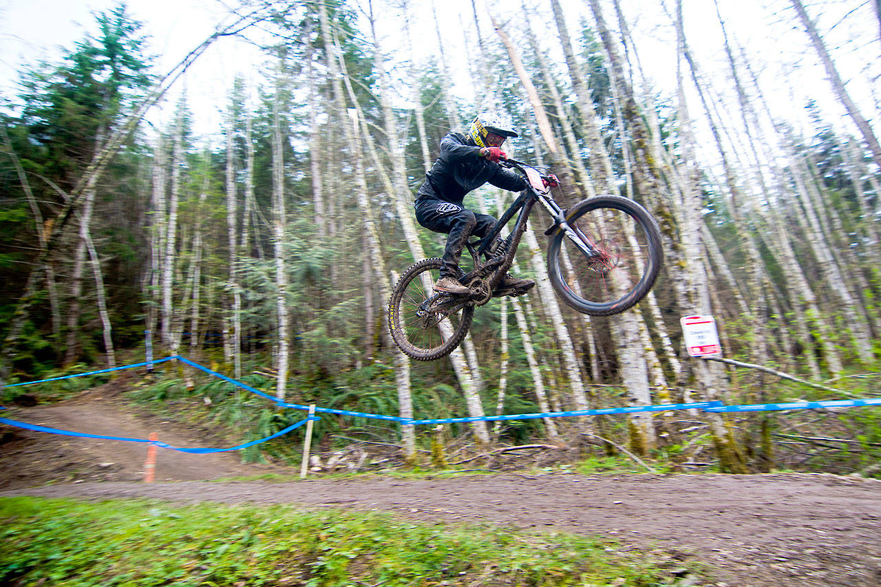 A competitor makes his way toward the finish line at the NW Cup downhill racing competition in Port Angeles on Sunday. More than 500 riders from all over the country and Canada competed in the event. (Jesse Major/Peninsula Daily News)