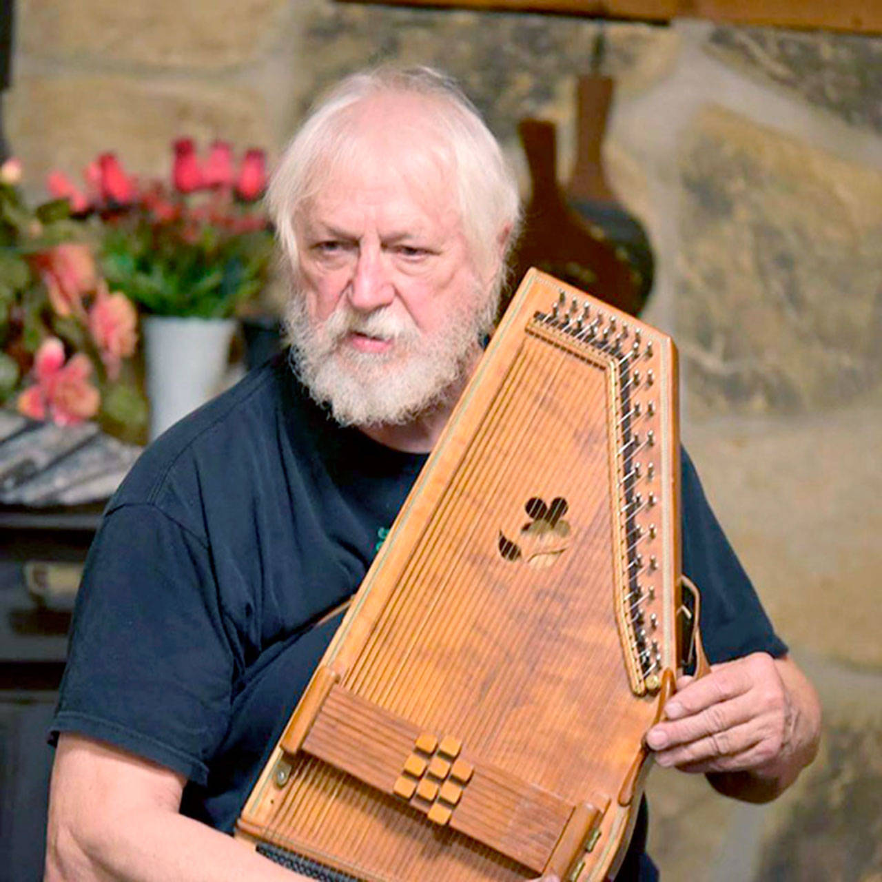 Bryan Bowers will accompany himself on the autoharp for his folk songs when he performs in Coyle on Saturday.