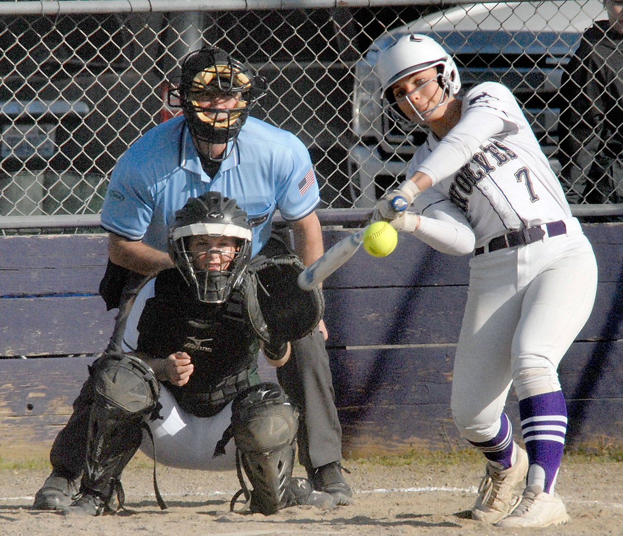 Keith Thorpe/Peninsula Daily News Sequim’s Isabelle Dennis, right, bats in the first inning as Port Angeles catcher Brennan Gray waits for the delivery on Wednesday at Sequim High School.