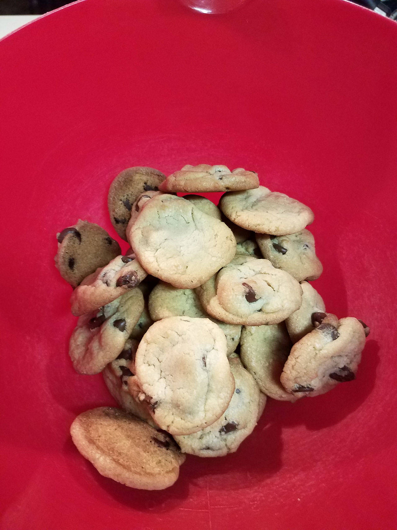 Bite-size chocolate chip cookies sit in a bowl, ready to be devoured. (Emily Hanson/Peninsula Daily News)