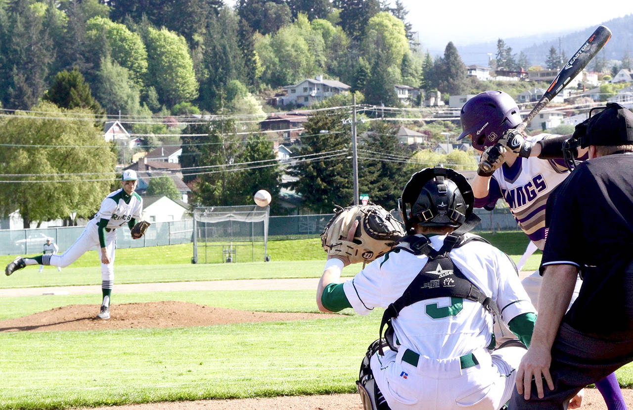 Port Angeles pitcher Colton McGuffey throws a strike to Riders’ catcher Joel Wood during the Roughriders’ 9-8 win over North Kitsap. McGuffey went 2 for 5 with an RBI double and Wood was 3 for 4 with the game-tying RBI double and scored the game-winning run as Port Angeles rallied to win the Olympic League 2A Division title.                                Dave Logan/for Peninsula Daily News