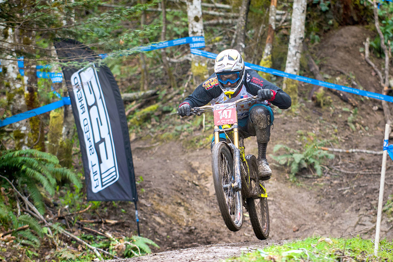 Jesse Major/Peninsula Daily News Matthew Macartney of Fall City makes his way toward the finish line at the NW Cup downhill mountain bike races at Dry Hill Bike Park near Port Angeles last month.