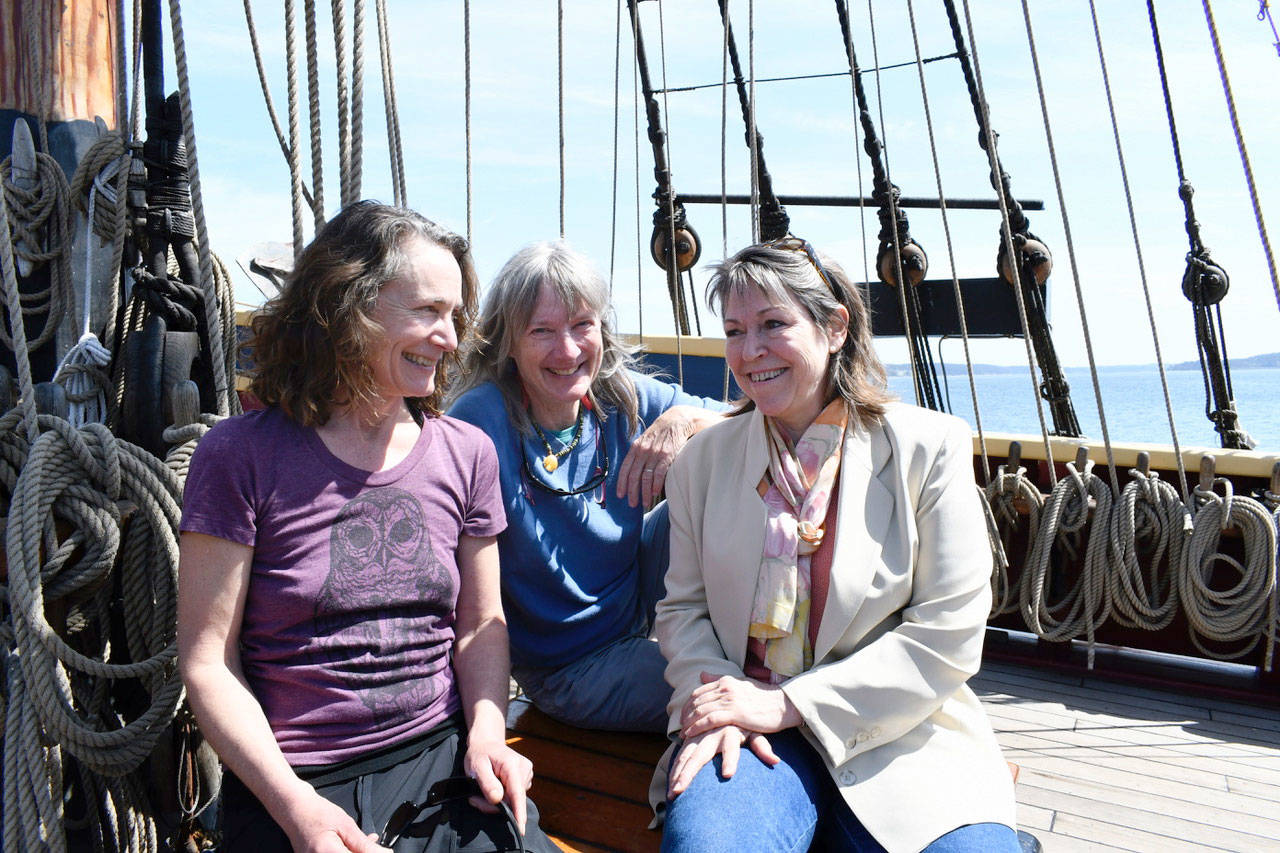 Aboard the Lady Washington, Port Townsend Marine Trades Association members, from left, Pam Petranek, Carol Hasse and Gwendolyn Tracy explain that they are investigating the role the maritime community plays in Jefferson County’s economy. The association hired a consulting firm to get a better understanding of the impact and will sponsor a fundraiser tonight to help defray the costs. (Jeannie McMacken/ Peninsula Daily News)
