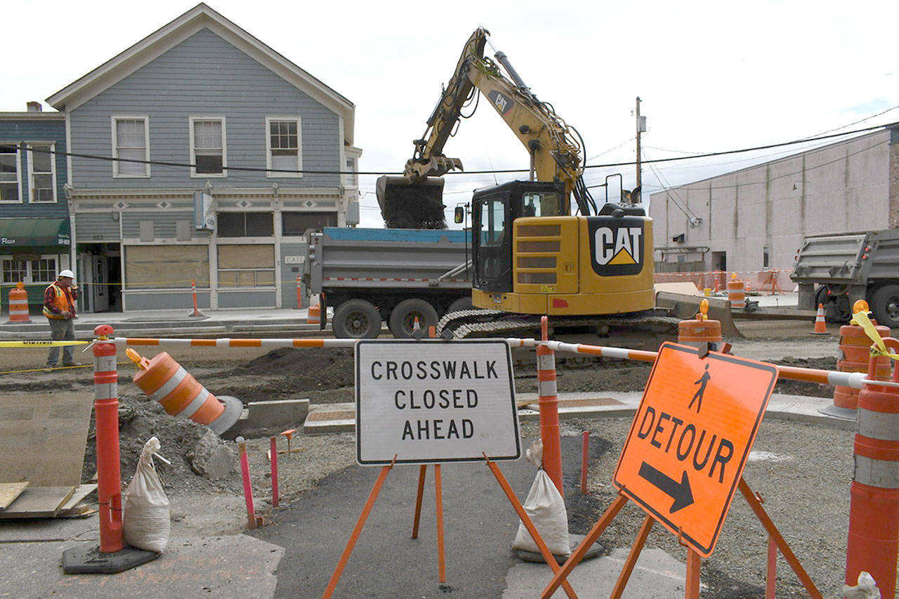 Work is underway to prepare for Thursdays paving of Water Street between Tyler and Polk streets. Once completed, the project moves south towards the ferry terminal. Street paving of the final section of the Water Street Enhancement Project will take place in June. The projects completion date is slated for June 27. (Jeannie McMacken/ Peninsula Daily News)