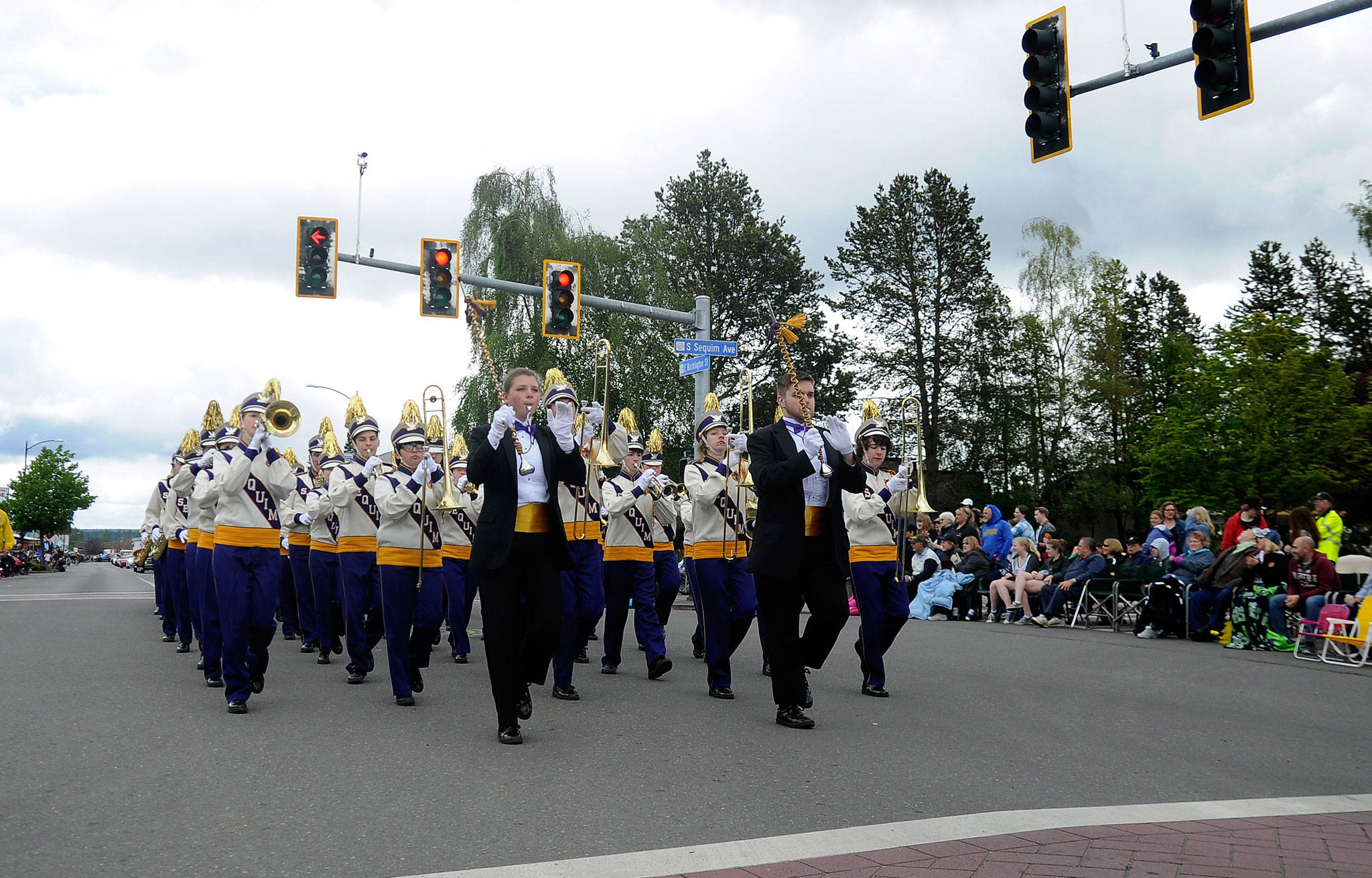 The Sequim High School Marching Band crosses Sequim Avenue in last year’s Sequim Irrigation Festival Grand Parade. This year they’ll make the trek along Washington Street as entry No. 18 on Saturday. (Michael Dashiell/Olympic Peninsula News Group)