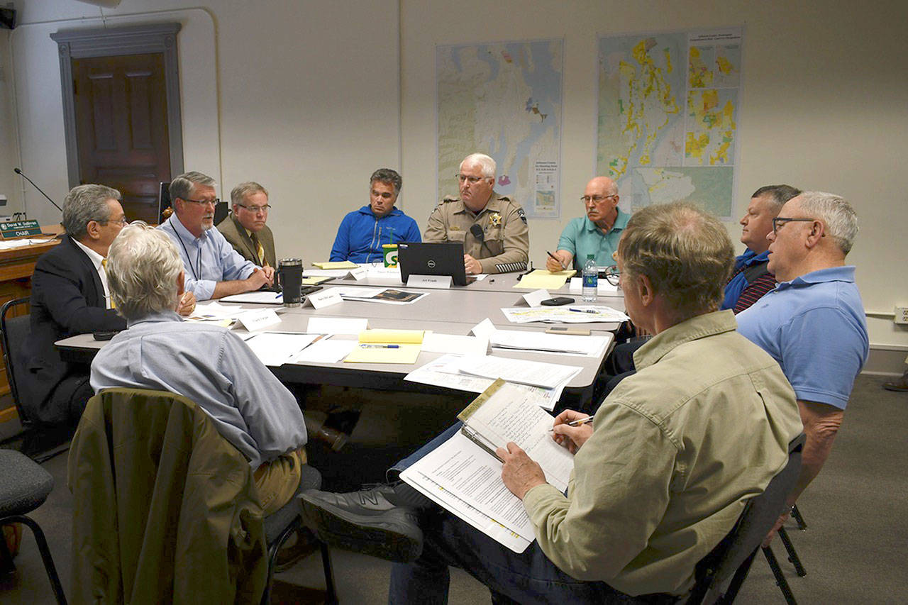 Members of Jefferson County’s Commercial Shooting Facilities Review Committee held their first meeting Wednesday to set an agenda and discussion topics. Mark McCauley, central services director representative, moderated the session. (Jeannie McMacken/ Peninsula Daily News)