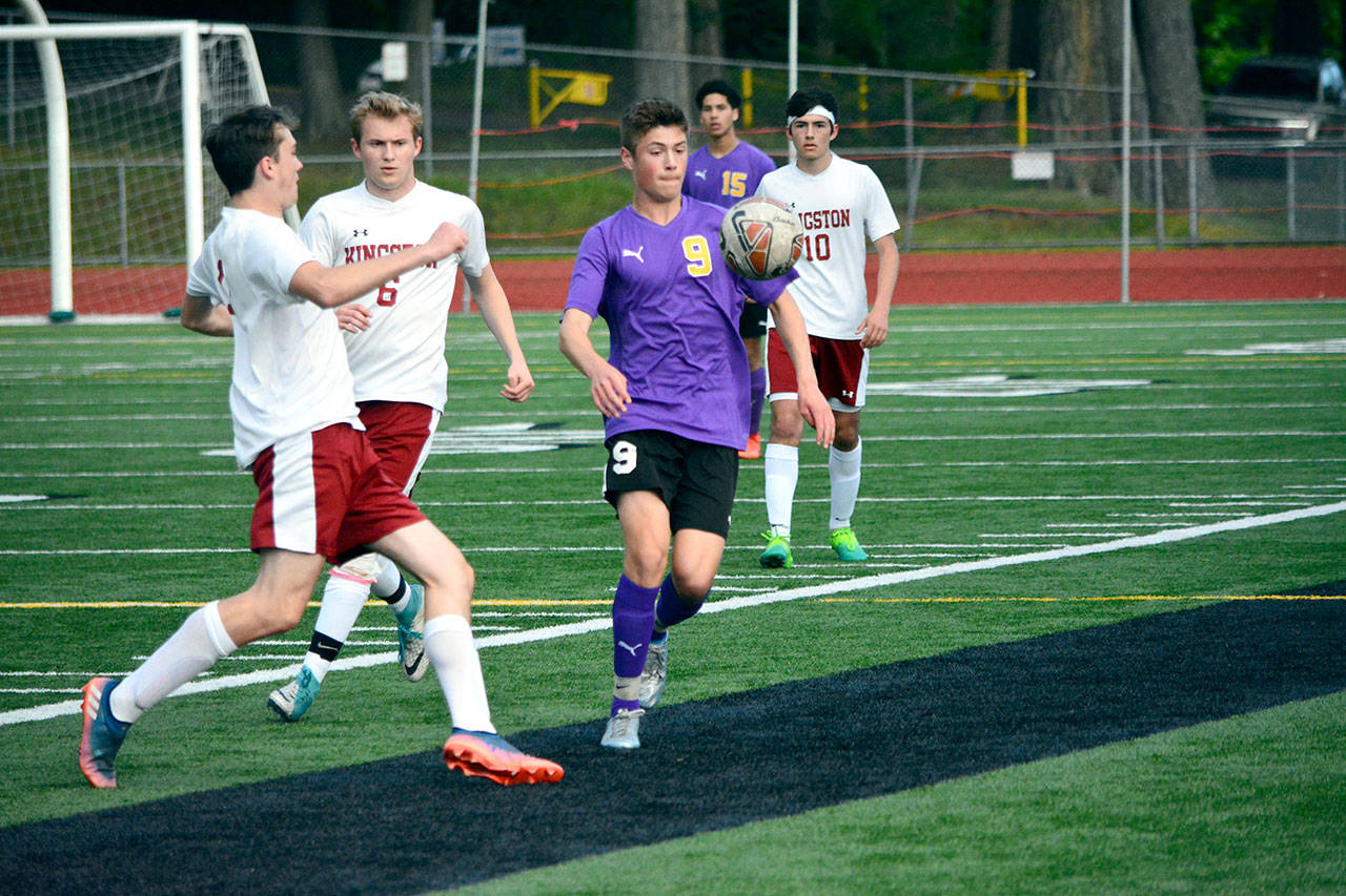 Mark Krulish/Kitsap News Group Sequim’s Adrian Funston attempts to settle the ball during the Wolves’ district tournament victory over Kingston.
