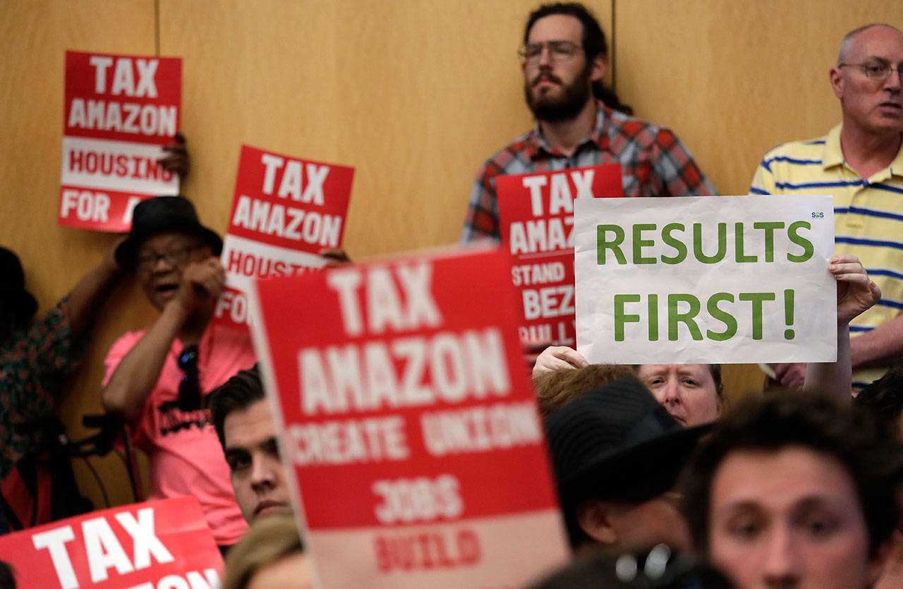 People fill seats before a Seattle City Council meeting where the council was expected to vote on a “head tax” Monday. (Elaine Thompson/The Associated Press)