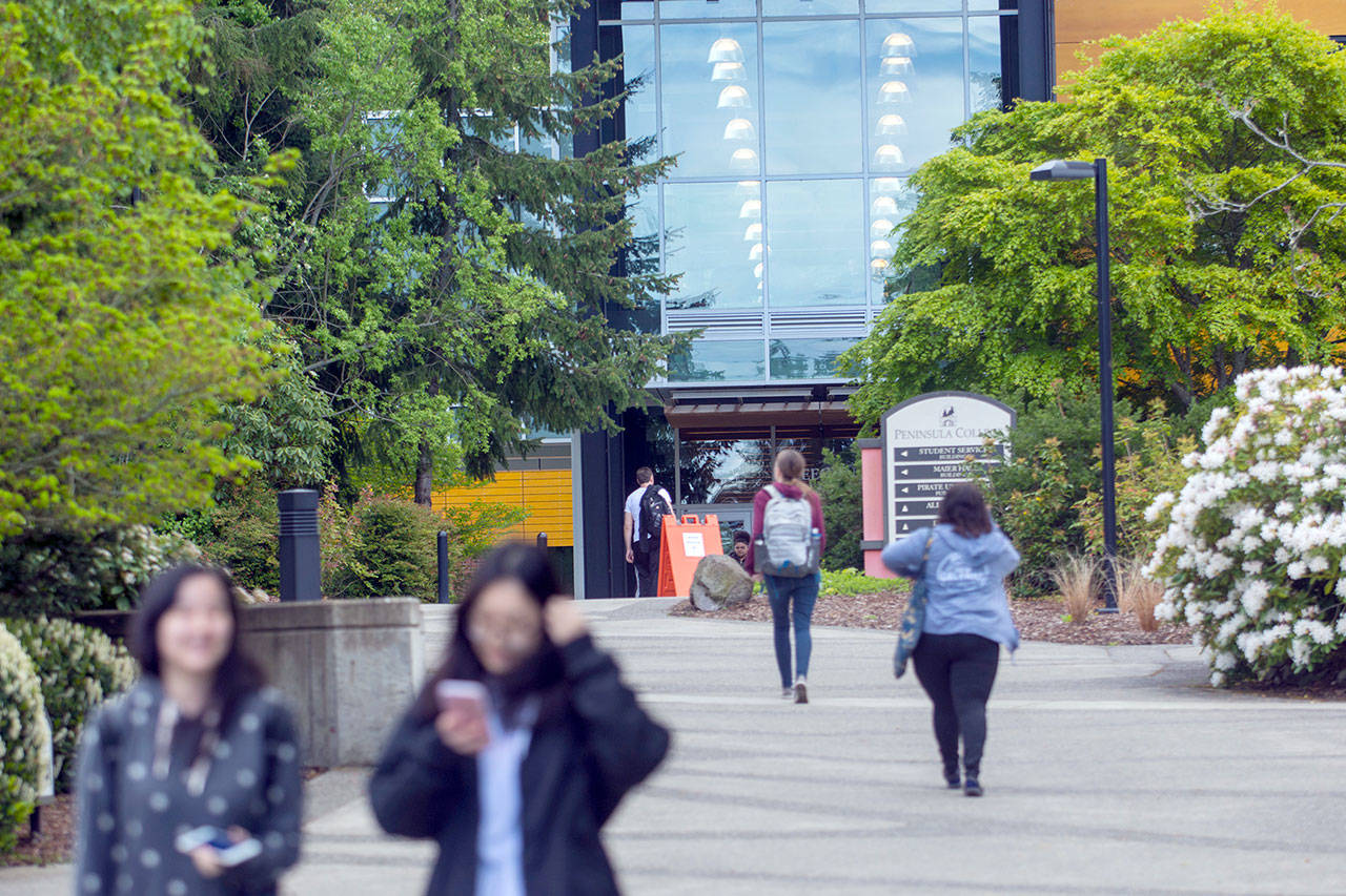 Students walk across the Peninsula College campus in Port Angeles recently. (Jesse Major/Peninsula Daily News)