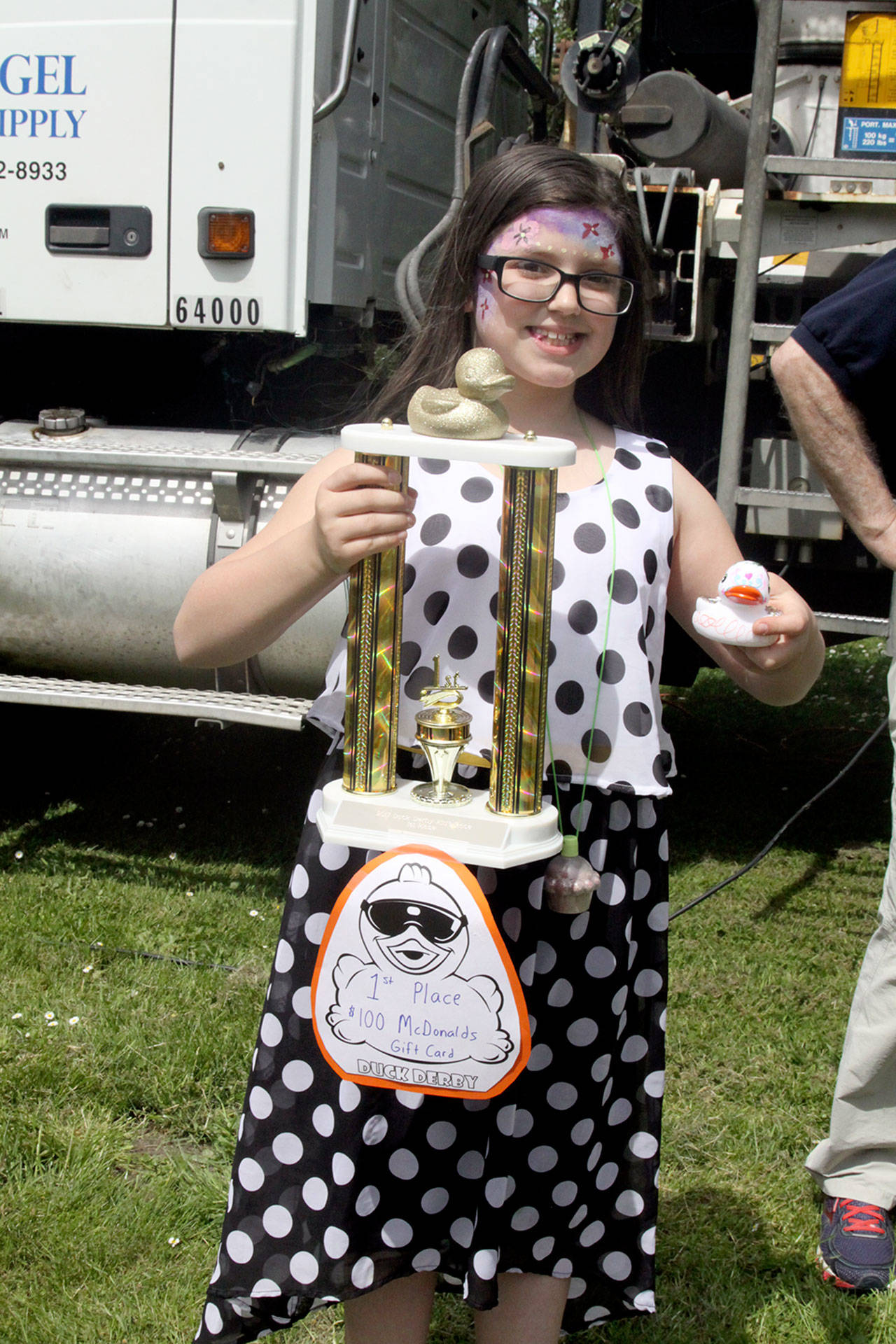 Autumn Wilson Rowland shows off her first-place trophy in the 2017 Duck Derby Duck Pluck.