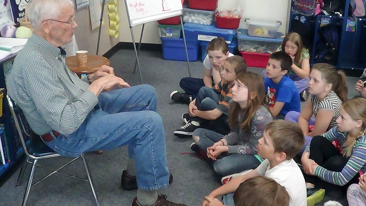Dennis Duncan tells a story to third-graders.