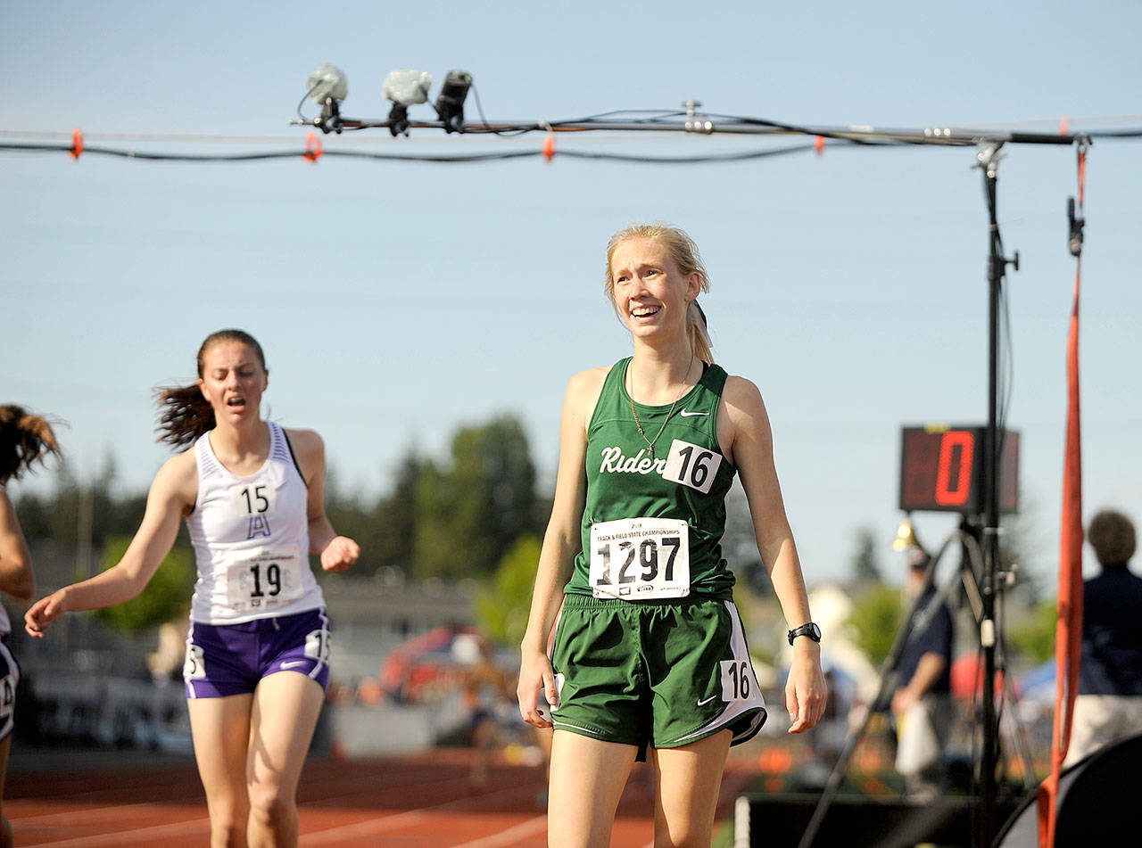 Port Angeles Gracie Long, right, reacts, after winning the 1,600 meters at the 2A State Track and Field Championships on Thursday. (Michael Dashiell/Olympic Peninsula News Group)