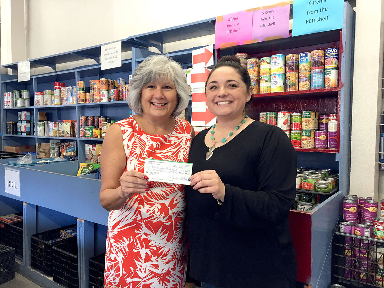 From left, Vivian Hansen, president of Nor’wester Rotary of Port Angeles, presents a $4,268.83 check to Jessica Hernandez, Port Angeles Food Bank executive director. The funds were raised through various rotary meetings.