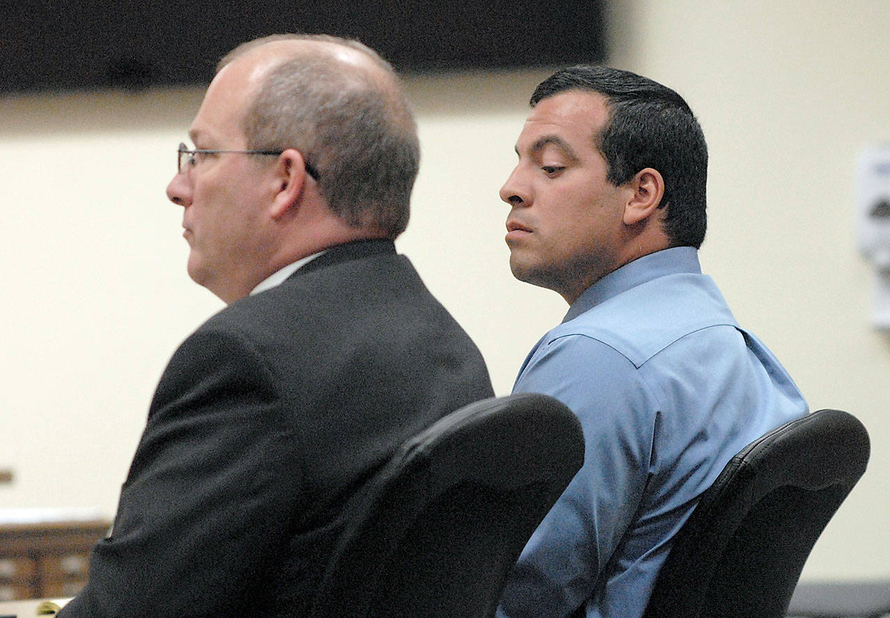 Nathan A. Chavez of Sequim, right, sits with attorney Stanley Myers during Wednesday’s opening arguments in Clallam County Superior Court. Chavez is facing five counts of third-degree child rape and single counts of third-degree child molestation, as well as witness tampering. (Keith Thorpe/Peninsula Daily News)