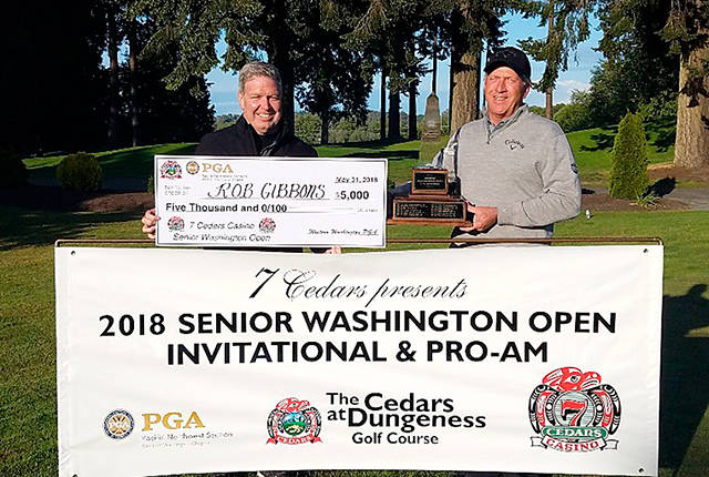 Western Washington PGA                                Cedars at Dungeness Director of Golf Bill Shea left, presents the $5,000 first place prize to 2018 Senior Washington Open winner Rob Gibbons.