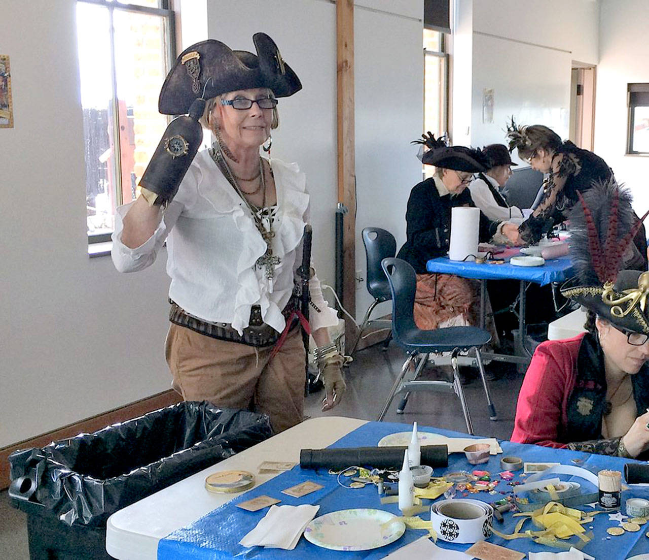 Lorilee Houston, Brass Screw Confederacy organizer, tries her hand at crafting in preparation for the Pinewood Derby races in the American Legion Hall on Saturday.