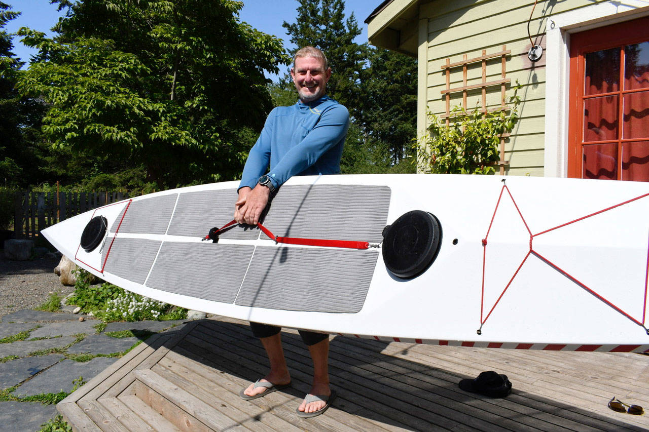 Chef Arran Stark is ready for Monday’s inaugural Seventy48 human-powered race from Tacoma to Port Townsend. He says his state-of-the-art paddle board will carry him 70 miles in 20 hours, with no stops. HIs gourmet fuel will include bone broth and a natural roast beef sandwich. (Jeannie McMacken/Peninsula Daily News)