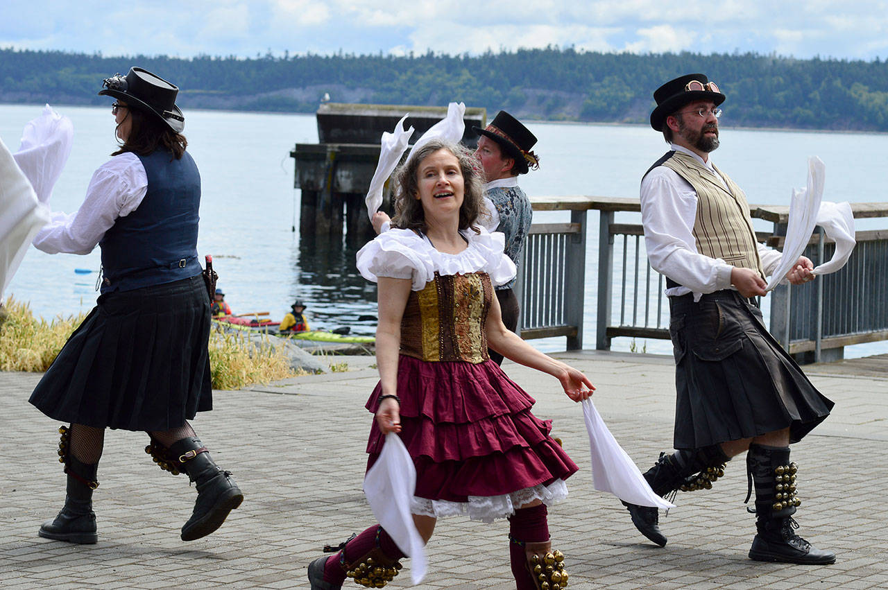 The Sound and Fury Morris Dancers from Seattle brought out the sunshine Saturday afternoon at the Steampunk Festival in Port Townsend. (Diane Urbani de la Paz/Peninsula Daily News)