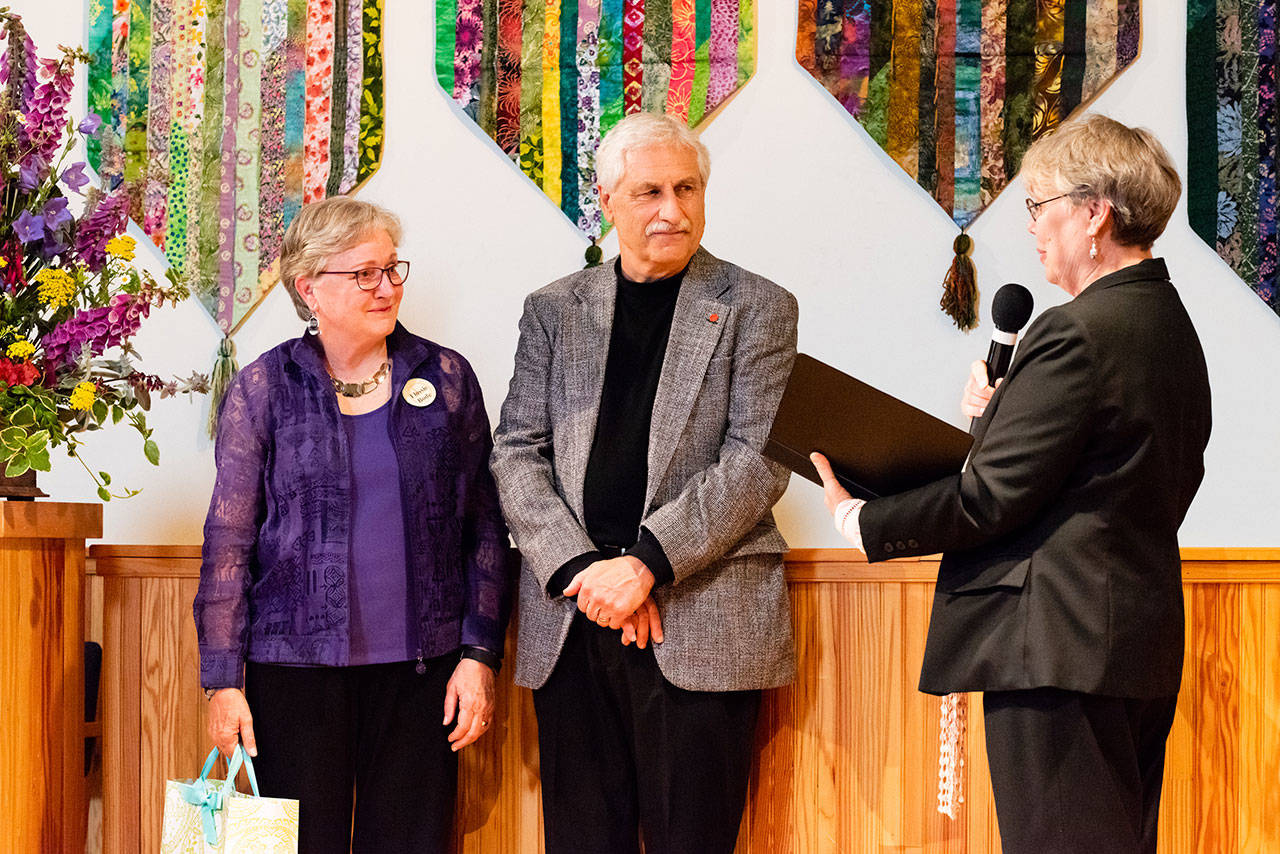 Bruce Bode, center, was feted with a retirement party June 10 at Quimper Uniterian Universalist Fellowship. To his left is his wife, Flossie Bode. QUUF Vice President Colleen Johnson is also shown. (Kay Harper)