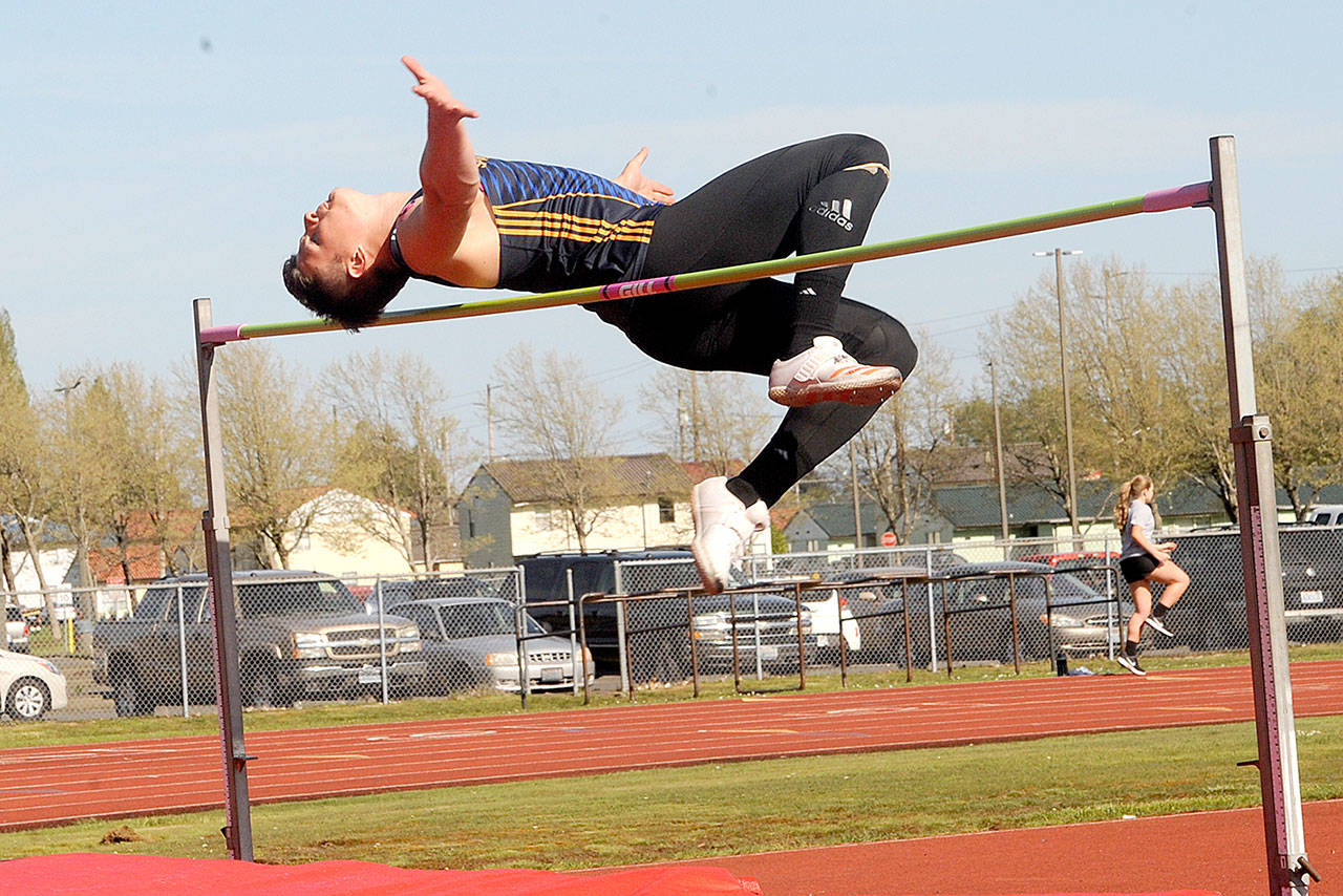 Forks Cole Baysinger clears 6 feet, 2 inches in the high jump at an Evergreen 1A meet in Hoquiam on May 2. Baysinger finished third in the state in the high jump and fifth in the 100-meter dash, though he took up the 100 midway through the season. He will compete in the decathlon next season for Lewis Clark State College in Lewiston, Idaho. (Lonnie Archibald/for Peninsula Daily News)