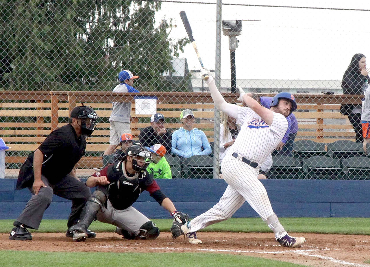 Port Angeles’ Kyle Schimpf, right, leads the West Coast League in home runs with five and hit-by-pitches with six.                                Dave Logan/for Peninsula Daily News