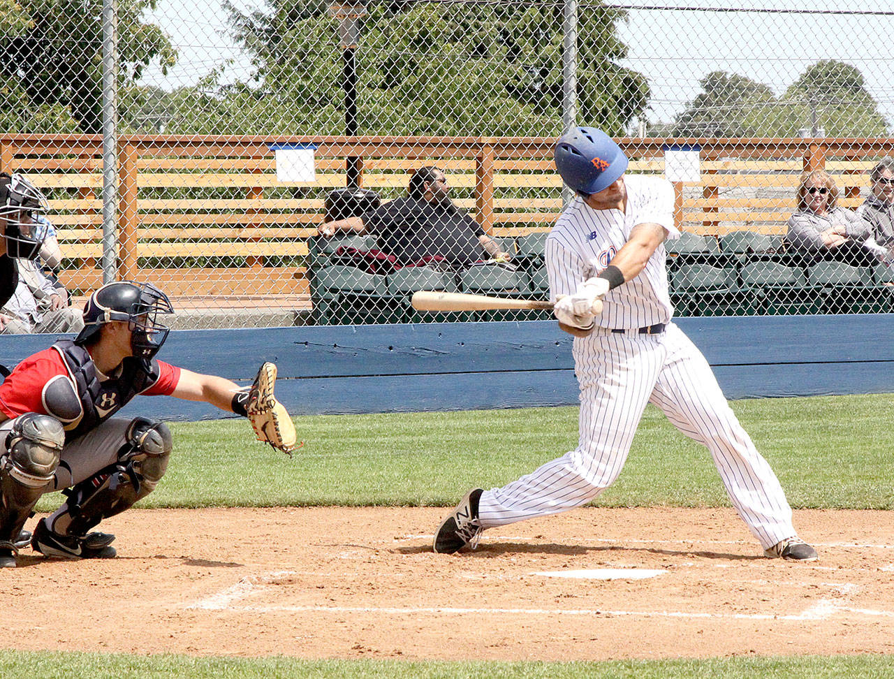 Austin Earl belts a solo run home run for the Port Angeles Lefties in the second inning Sunday against Wenatchee. (Dave Logan/for Peninsula Daily News)