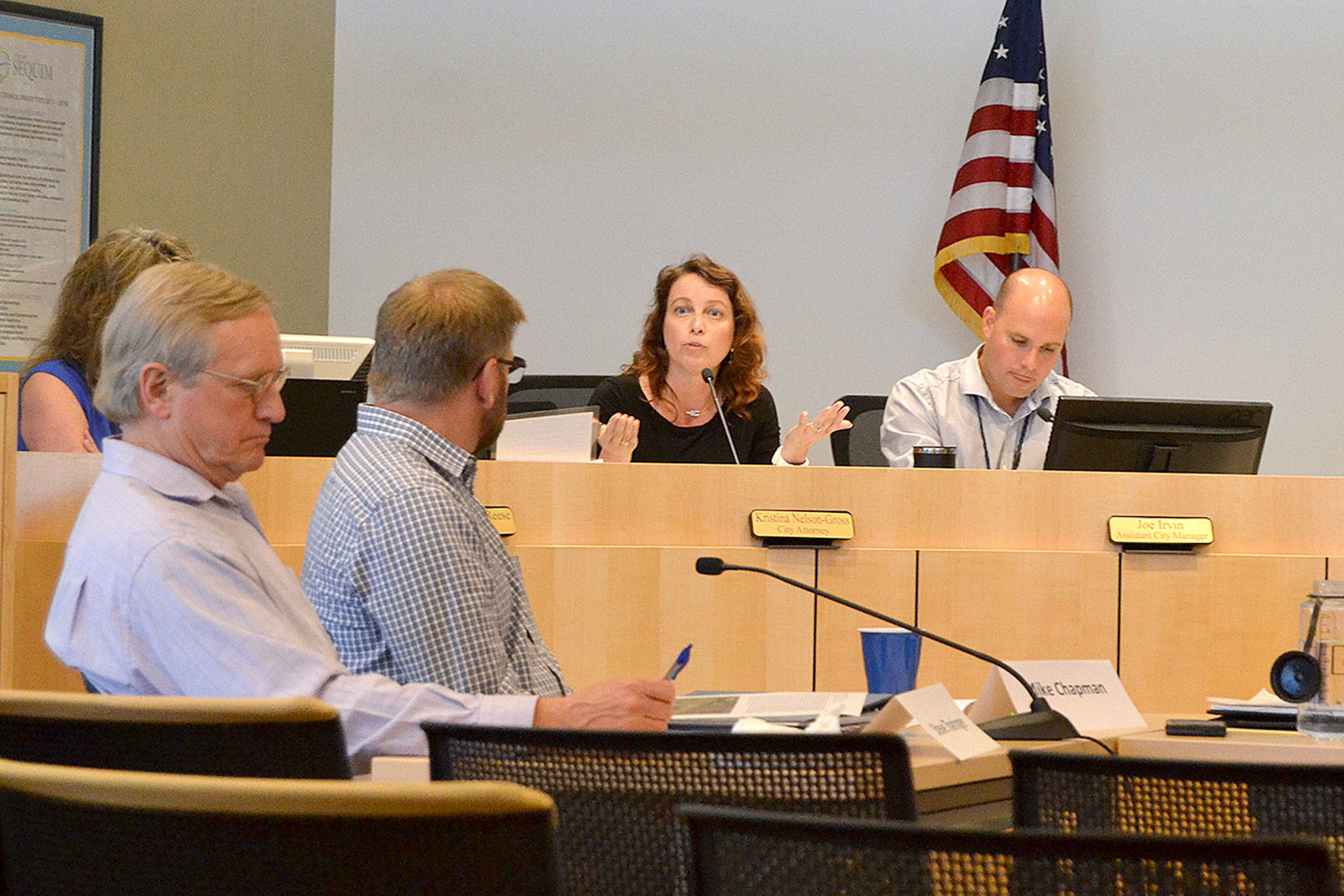 Sequim City Attorney Kristina Nelson-Gross speaks to state reps. Steve Tharinger and Mike Chapman about the impact of public information requests. (Matthew Nash/Olympic Peninsula News Group)