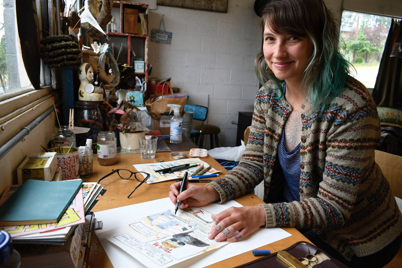 Comic creator Nhatt Nichols is an embedded artist/storyteller for this year’s Race to Alaska. Nichols has been blending her artistic skills and sense of humor to illustrate the stories of the participants’ experiences during the race. (Jeannie McMacken/Peninsula Daily News)