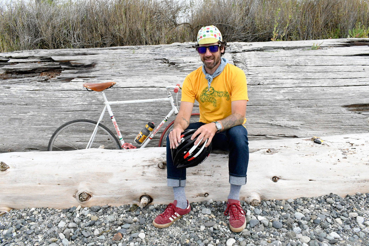 Cyclist and father Mike Tapogna will cycle east beginning Saturday in a quest to raise awareness and funds for Seattle Children’s Hospital Autism Center. His goal is to reach New York City in 40 days. His son Luca’s stuffed duck named Tallish will be part of the adventure. (Jeannie McMacken/Peninsula Daily News)