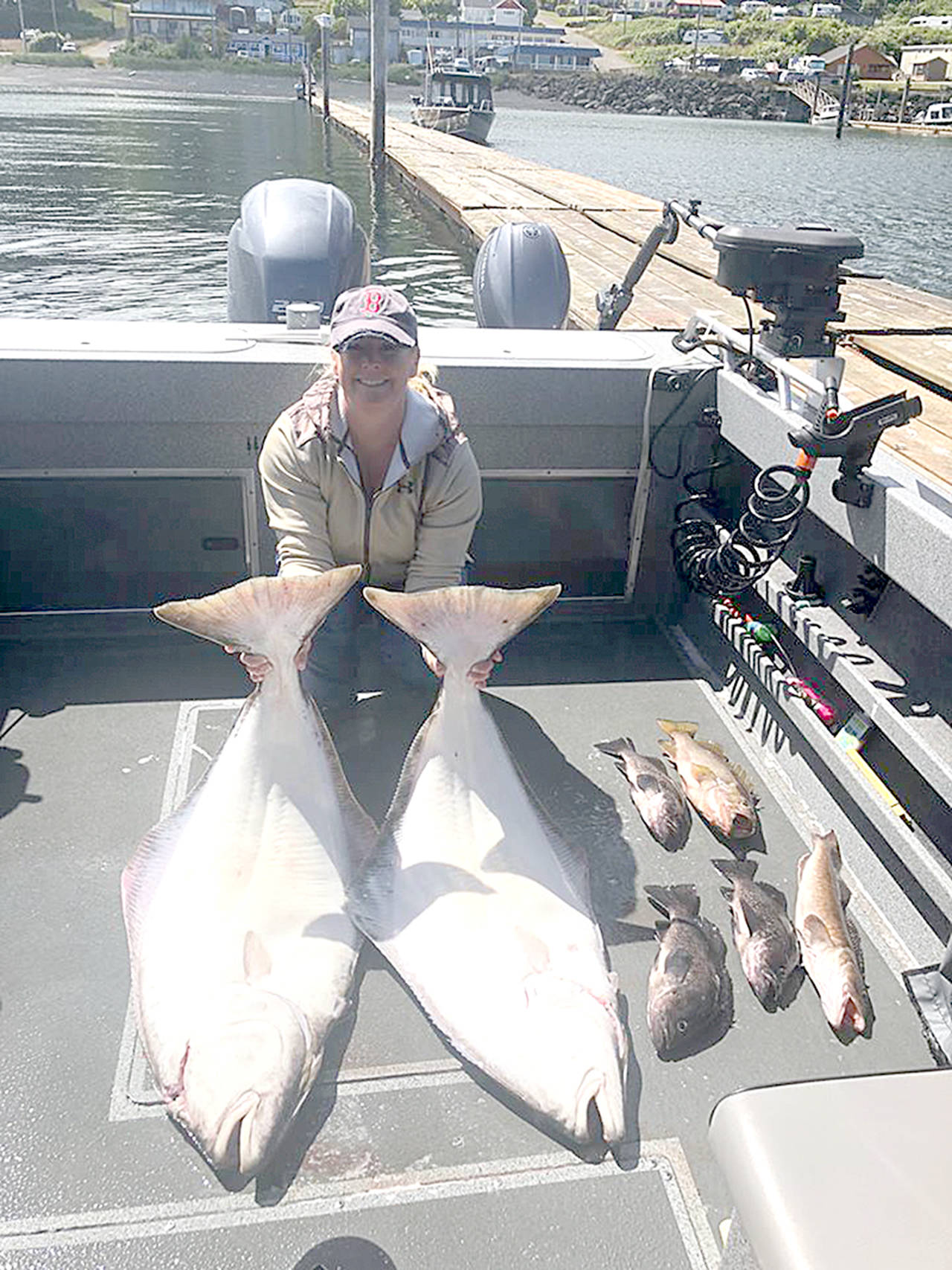 Anglers Koral Miller, pictured, and her husband Chris, brought these good-sized halibut back to the docks at Mason’s Olson Resort in Sekiu last Saturday.