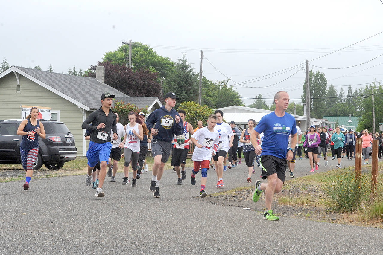 Lonnie Archibald/for Peninsula Daily News Around 110 runners and walkers turned out for the annual Forks Fourth of July Fun Run on Saturday. Paul Hampton won the 10-kilometer run in 43 minutes, 40 seconds. Connor Earls claimed the 5K in 23:45. Proceeds went to Forks High School basketball.