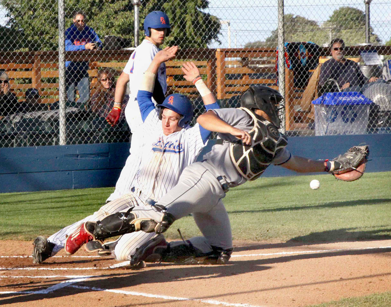 The Lefties’ Justin VanDebrake slides safely into home as the Falcon catcher Josh Figueroa can’t catch the off-line throw to the plate by second baseman Tylor Nixon in the first inning during a double steal. The Lefties went on to win 5-4. (Dave Logan/for Peninsula Daily News)