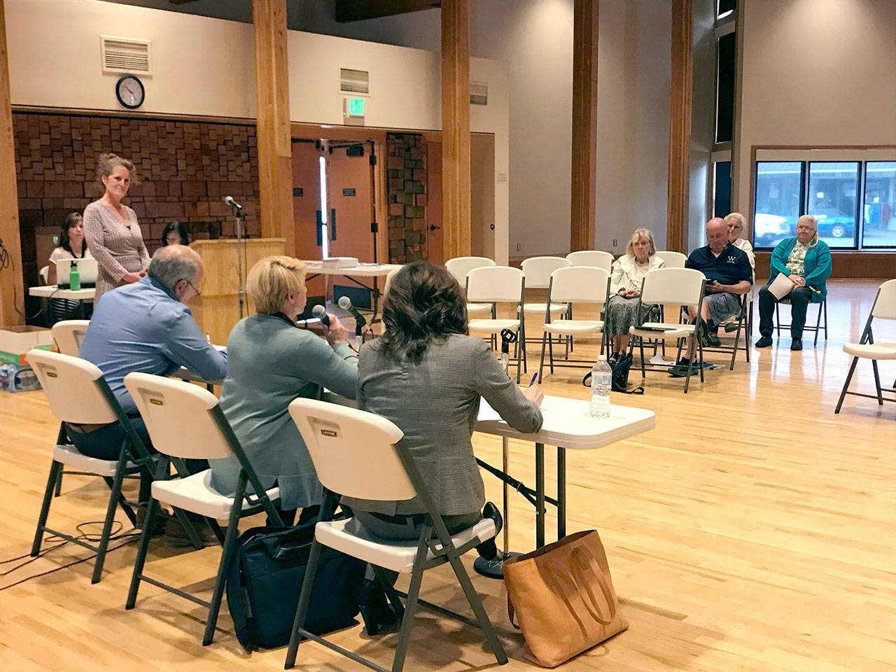 Holly O’Neil of Crossroads Consulting, standing far left, facilitated the Port of Port Angeles commissioners’ meeting in Forks, the first of the board’s three countywide “listening sessions” held Monday on the future of John Wayne Marina in Sequim. (Paul Gottlieb/Peninsula Daily News)