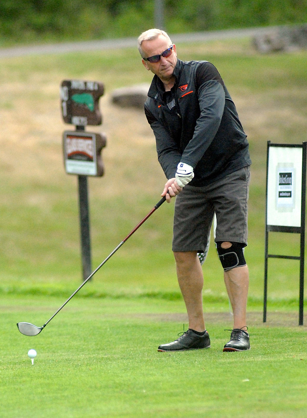 Keith Thorpe/Peninsula Daily News Peninsula Golf Club member Rick Hoover of Port Angeles tees off on the first hole of the Clallam County Amateur at Peninsula Golf Club in Port Angeles on Friday. The tournament wraps up today at Cedars at Dungeness in Sequim. Curtis Rose of Victorias Madrona Links Golf Course and Jade Tisdale of Peninsula Golf Club were tied for the lead after posting rounds of 3-over-par 75.