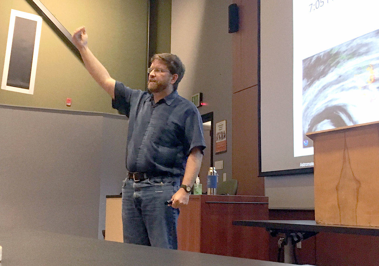 Marc Fries, NASA cosmic space dust curator, speaks at Peninsula College on Thursday. Fries and the crew of the exploration vessel Nautilus believe they discovered Monday small fragments of a meteorite that exploded over the Olympic Coast National Marine Sanctuary on March 7. (Rob Ollikainen/Peninsula Daily News)