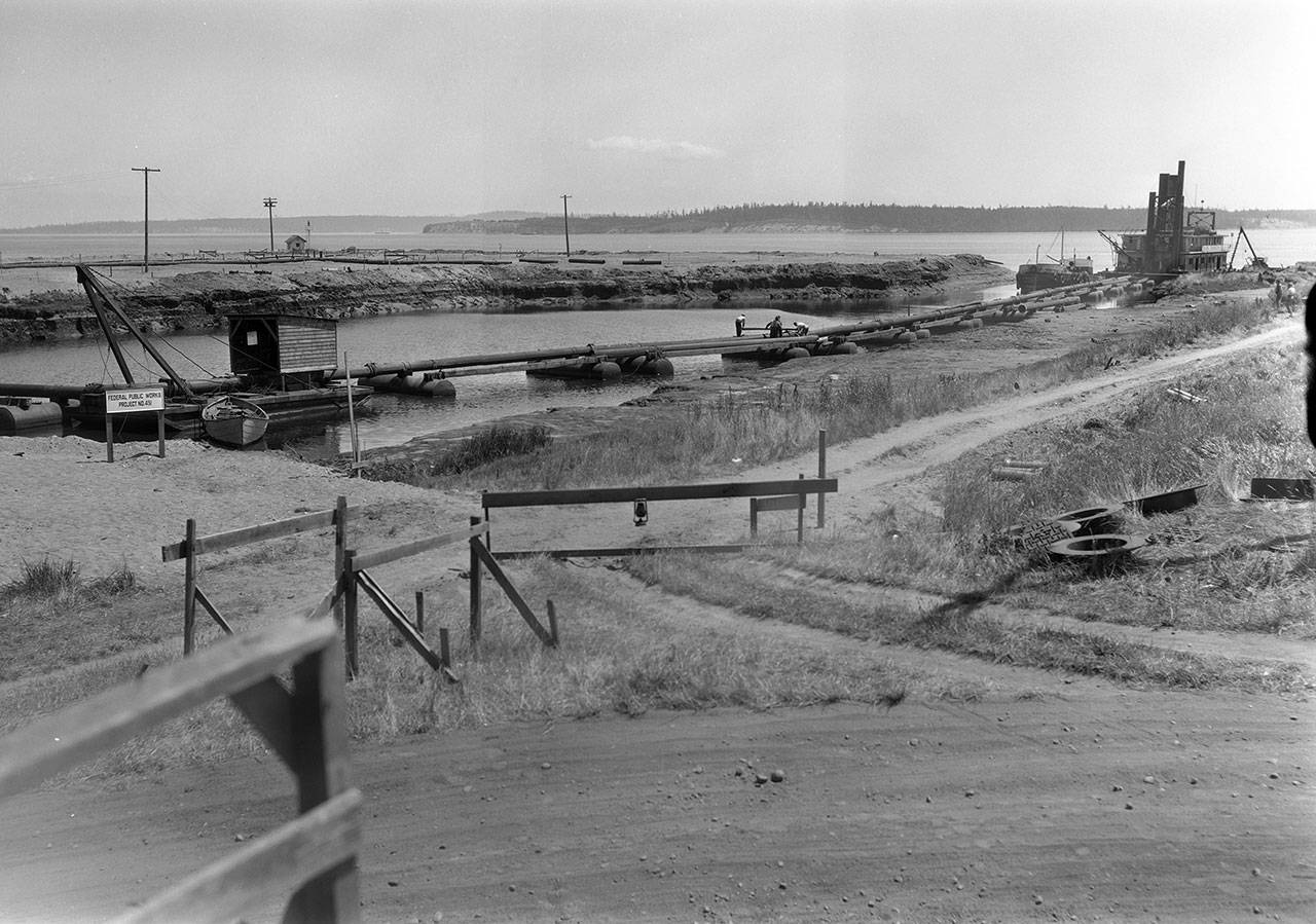 A view of dredging operations at Point Hudson looking toward the harbor mouth is shown July 3, 1934. (Jefferson County Historical Society)