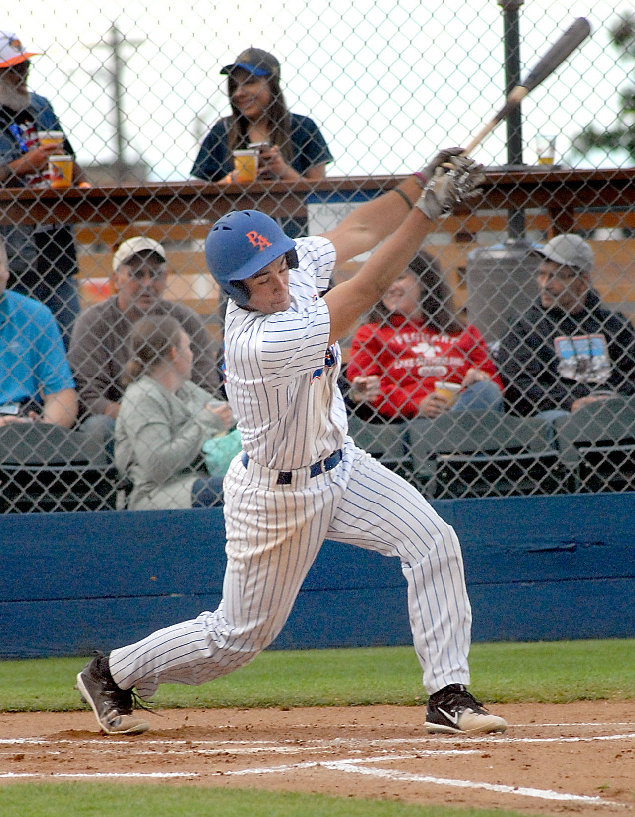 Keith Thorpe/Peninsula Daily News Lefties’ Jason Dicochea bats in a July 6 game against the Yakima Pippins at Port Angeles Civic Field.