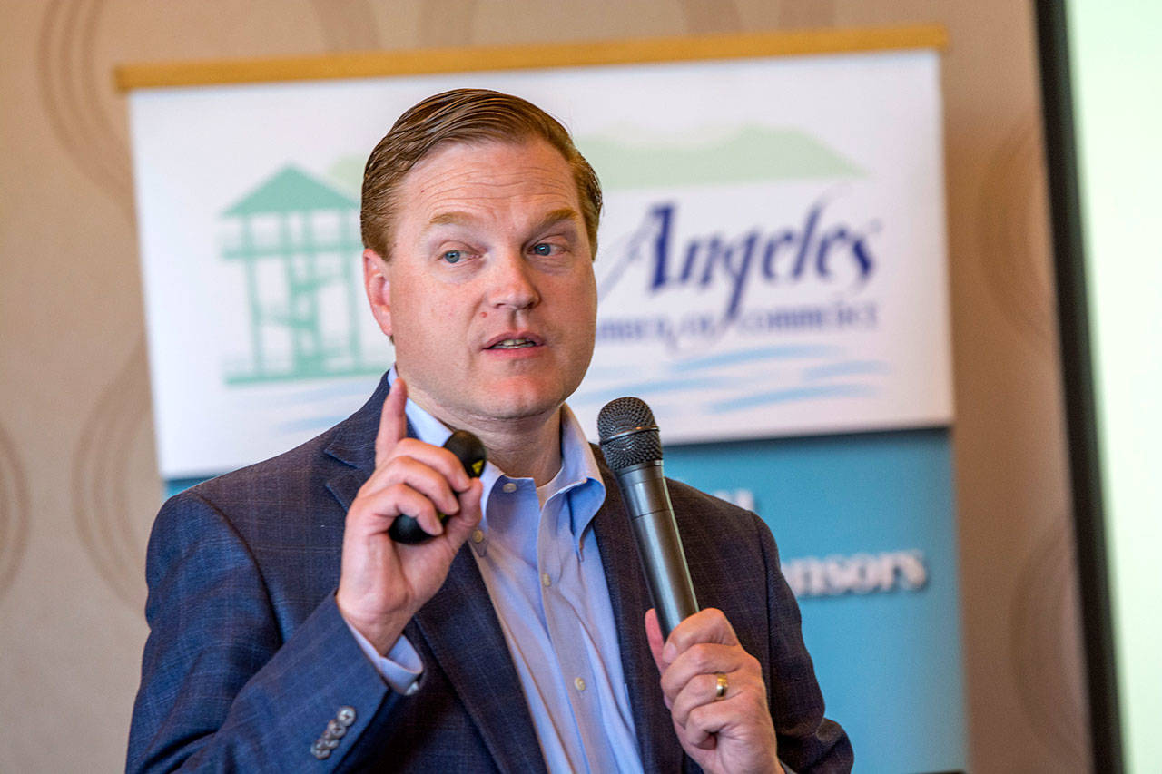 Kris Johnson, president and CEO of the Association of Washington Business, speaks at the Port Angeles Regional Chamber of Commerce’s luncheon Wednesday. (Jesse Major/Peninsula Daily News)