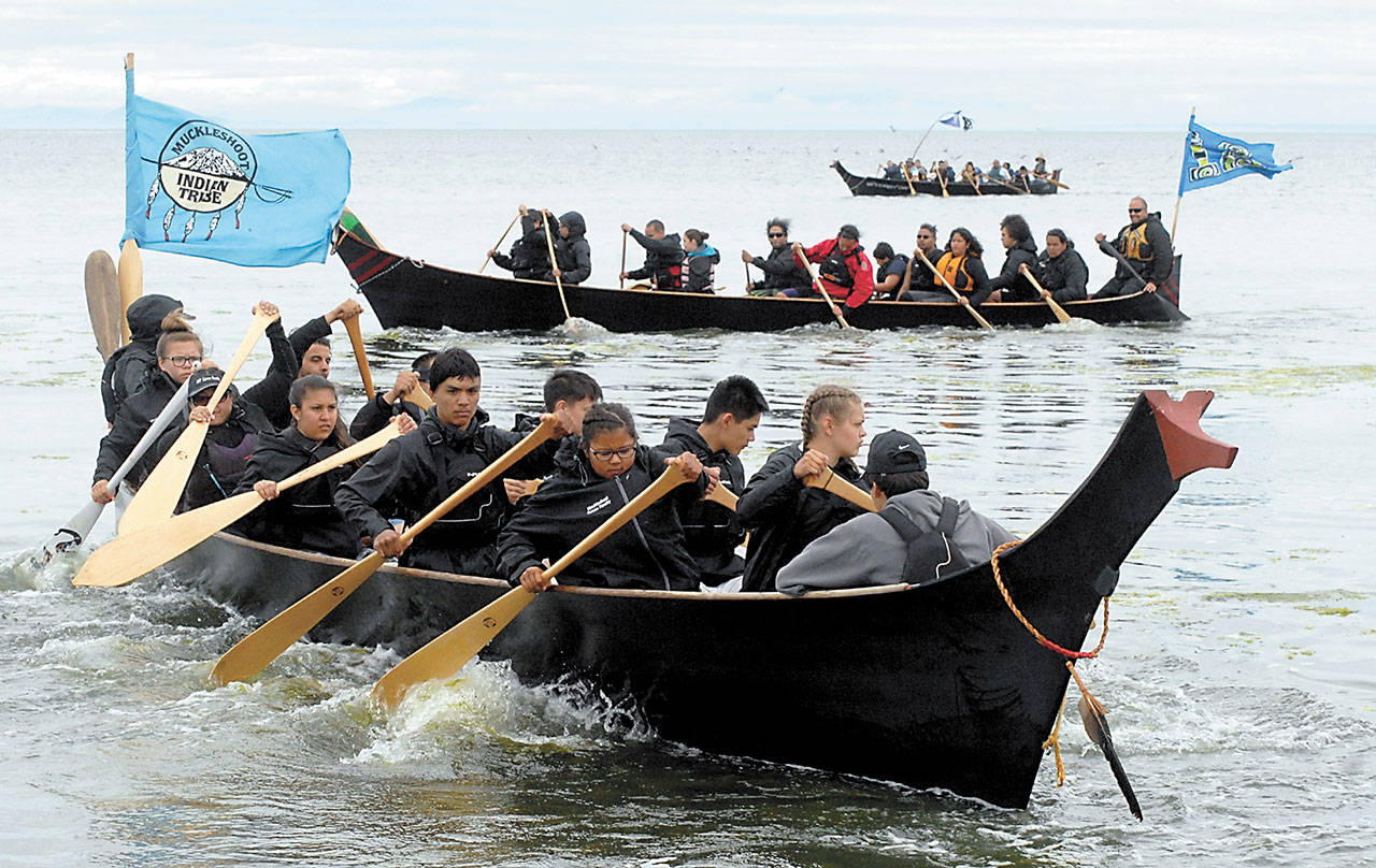 Two canoes belonging to the Muckleshoot Tribe, front, and the Chief Leschi canoe of the Puyallup Tribe circle in Dungeness Bay before their landing at Jamestown Beach duing the 2016 canoe journey. (Keith Thorpe/Peninsula Daily News)