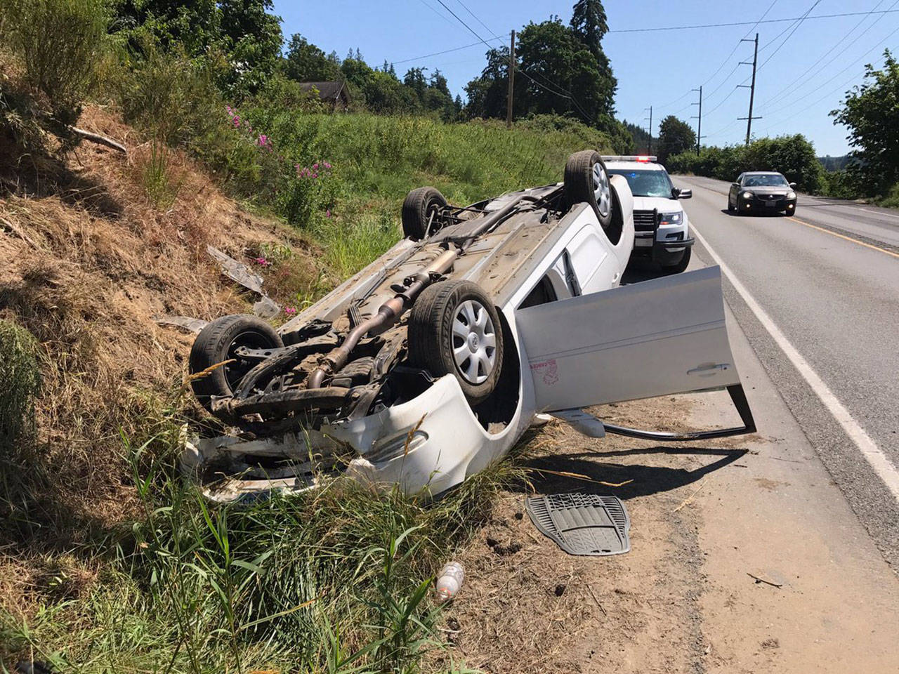 A vehicle traveling on state Highway 19 near Chimacum hit soft dirt on the side of the road and flipped Sunday afternoon. The driver and passenger were both airlifted to Harborview Medical Center. (Washington State Patrol)
