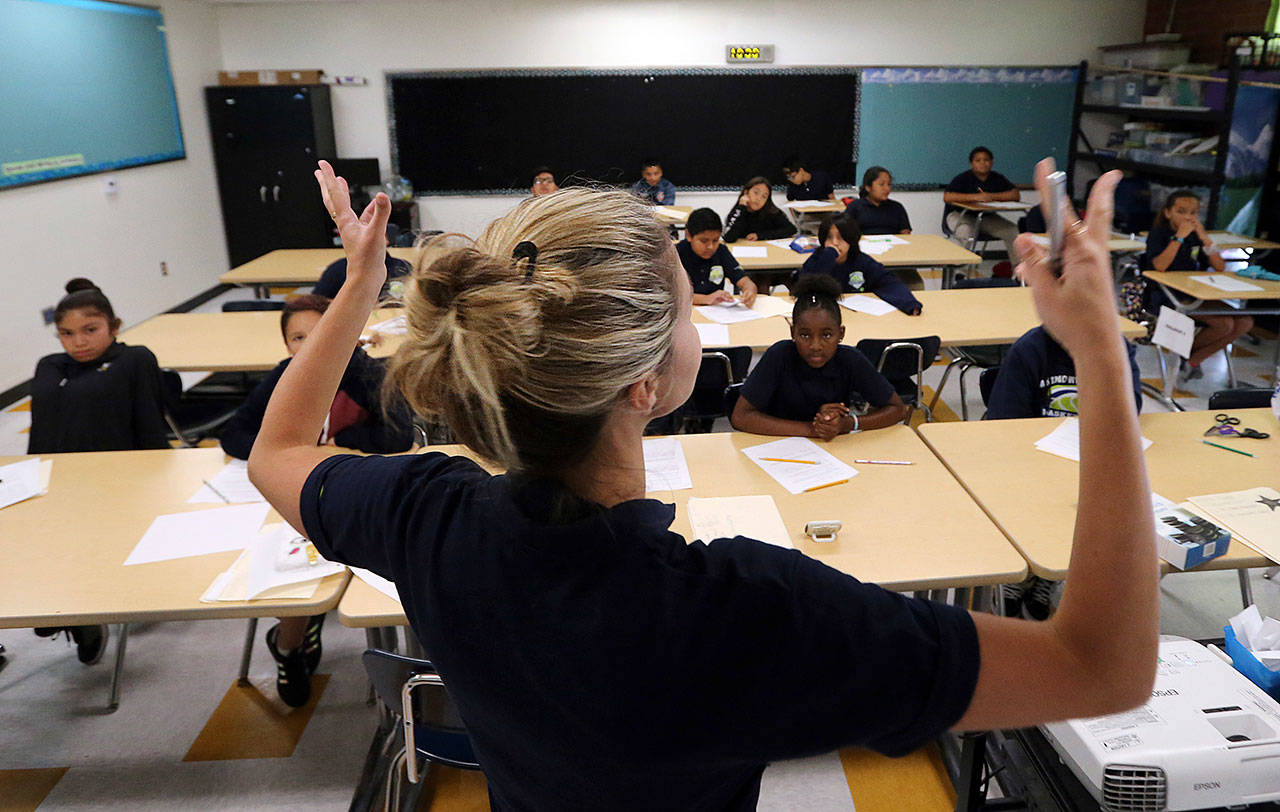 Teacher Zara Gibbon gestures while teaching a group of incoming sixth-graders at Animo Westside Charter Middle School during a summer session to introduce new students to the school they will attend in the fall in the Playa Del Rey area of Los Angeles. (Reed Saxon/The Associated Press)
