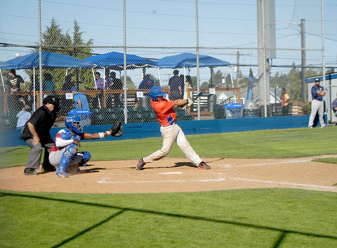 The Lefties’ Ronnie Rust fouls off a pitch against Victoria on Monday. Rust finished the game with two hits, including a two-run double in the Lefties’ 9-7 win. (Pierre LaBossiere/Peninsula Daily News)