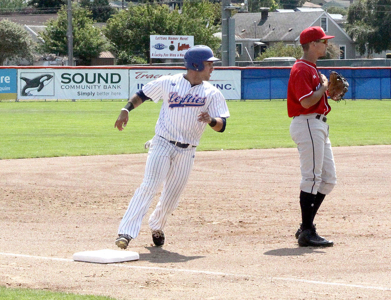Lefties baserunner Austin Earl rounds third base on the way to home as the Lefties took a 4-0 lead after two innings against Walla Walla on Sunday. They went on to win 7-4. (Dave Logan/for Peninsula Daily News)