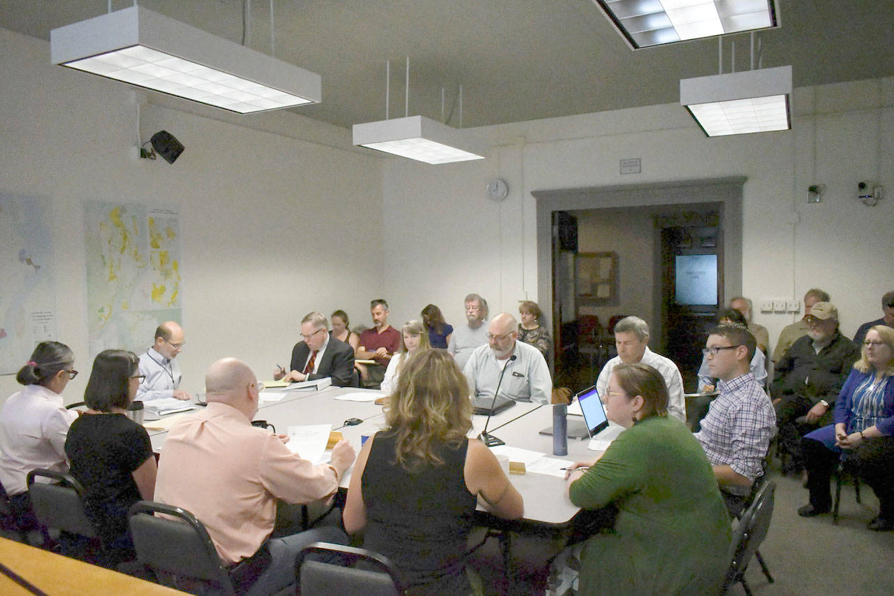 The Jefferson County Commissioners, members of the Port Townsend city council, representatives from OlyCAP and county staff met to begin discussion of a new interlocal agreement to help extremely low income persons and homeless persons and fund a year-round shelter. (Jeannie McMacken/Peninsula Daily News)