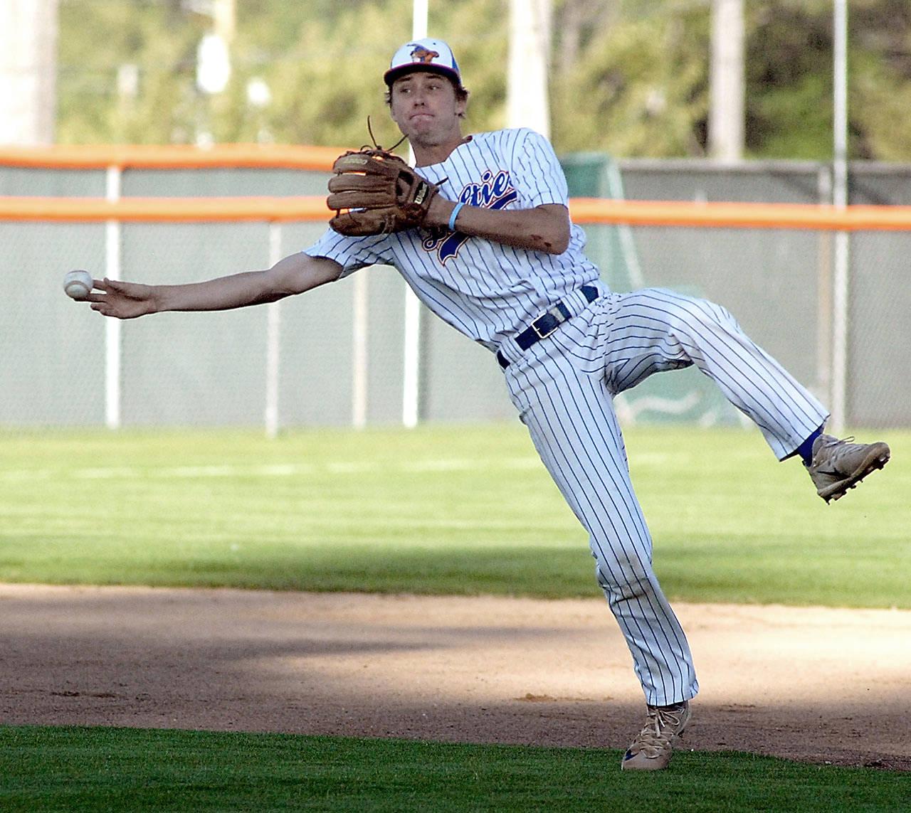 Keith Thorpe/Peninsula Daily News Lefties shortstop Trevor Rosenberg makes an off-balance throw to first on Friday evening at Port Angeles Civic Field.