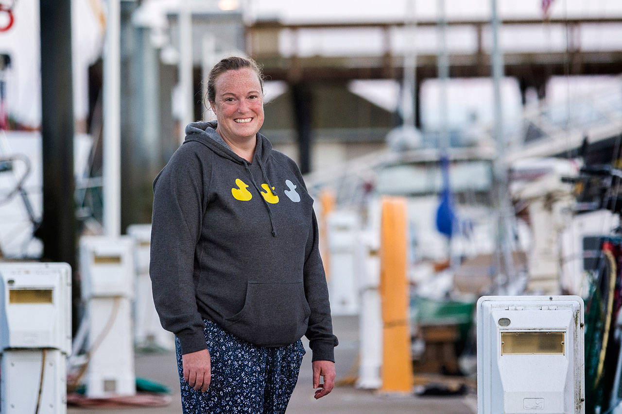 Michelle Macy, a marathon swimmer from Portland, Ore., stands at the Port Angeles Boat Haven before starting her swim across the Strait of Juan de Fuca on Monday morning. (Jesse Major/Peninsula Daily News)